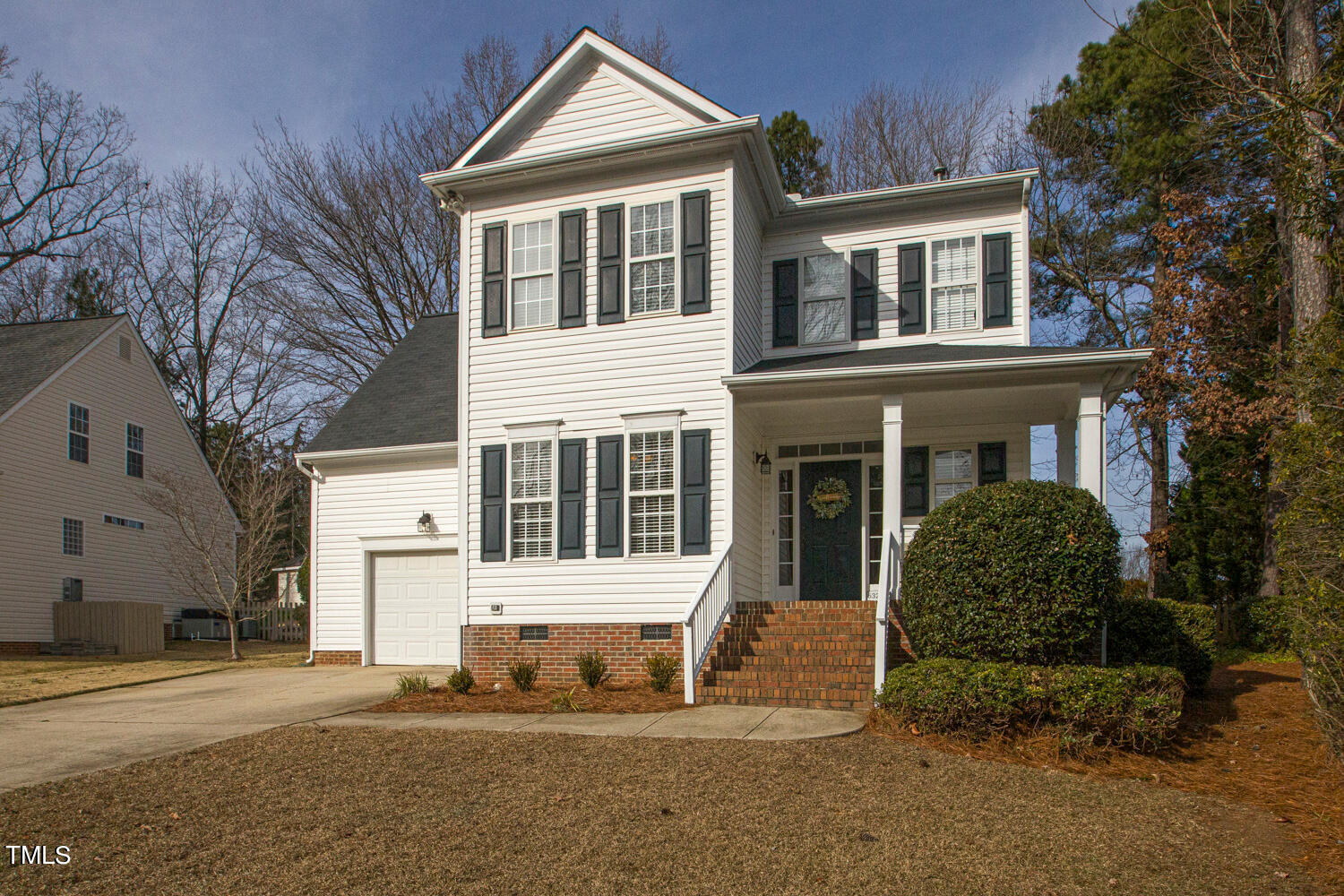 6324 Nowell Pointe Drive Raleigh, NC 27607 - Photo 2 of 50 a front view of a house with a yard