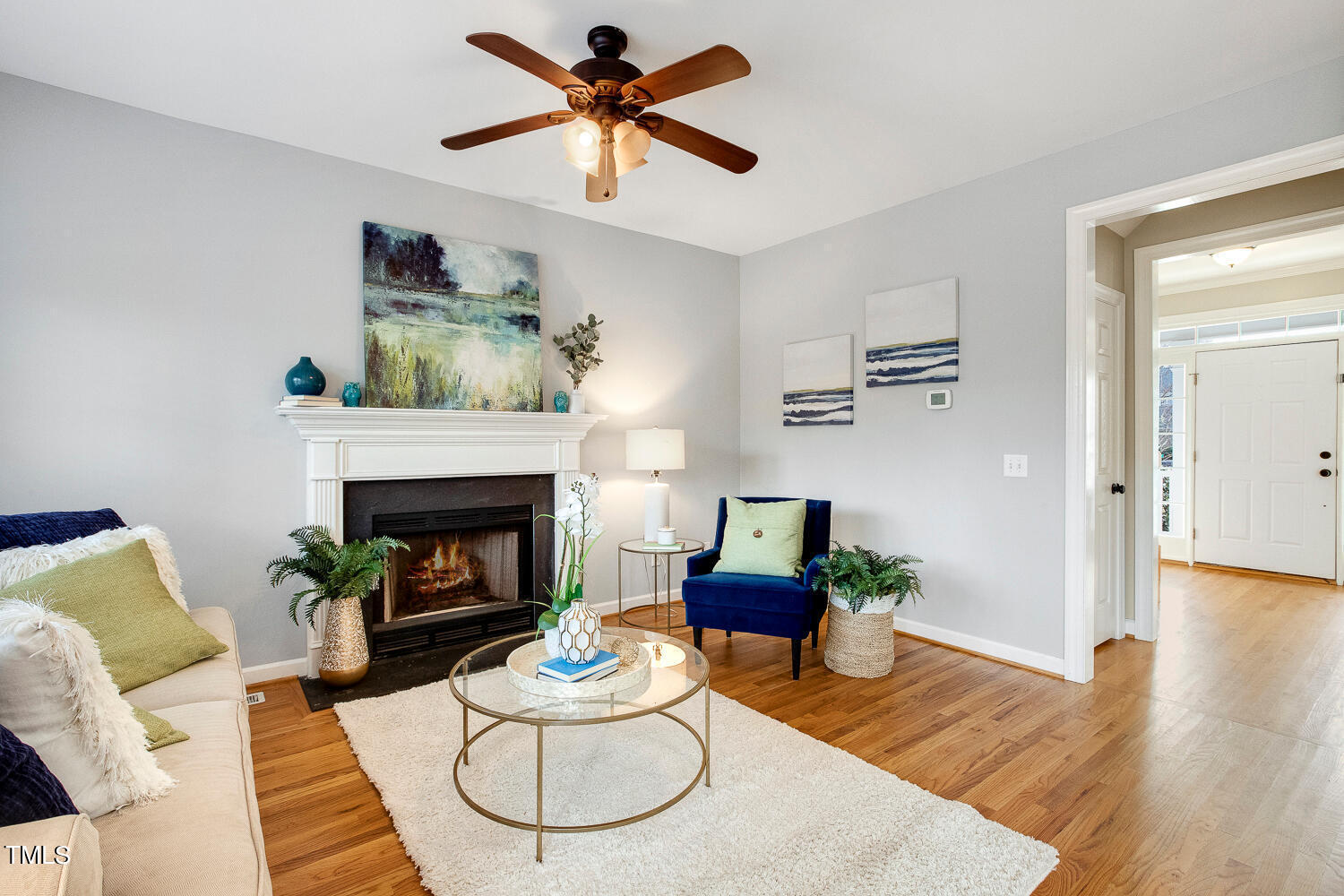 6324 Nowell Pointe Drive Raleigh, NC 27607 - Photo 21 of 50 a living room with furniture and a fireplace