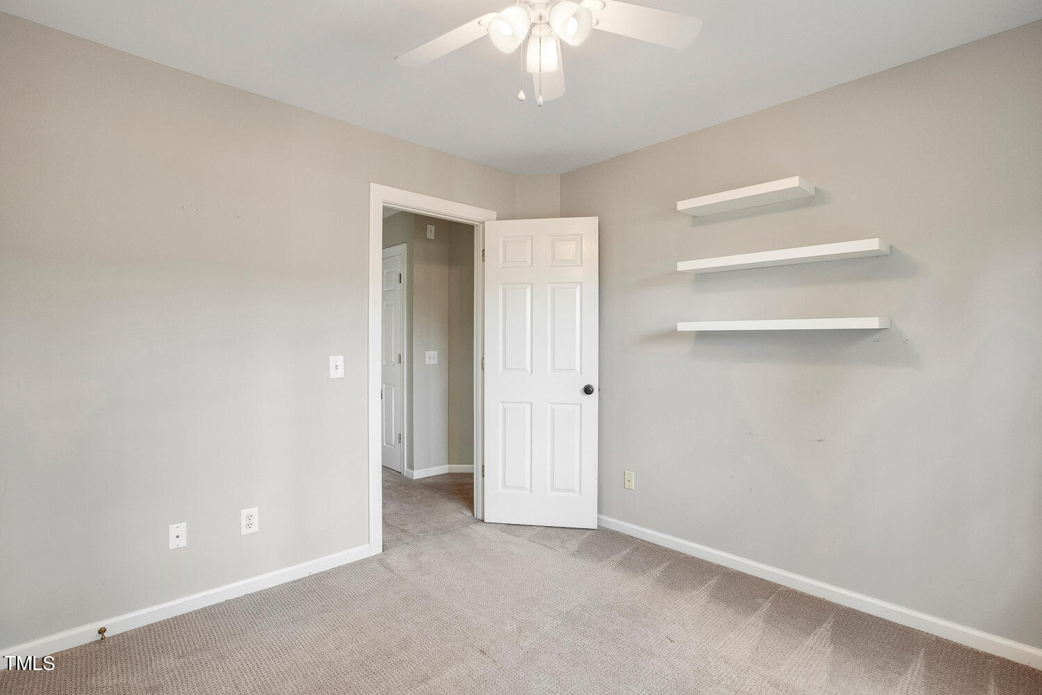 6324 Nowell Pointe Drive Raleigh, NC 27607 - Photo 32 of 50 a view of an empty room with a window