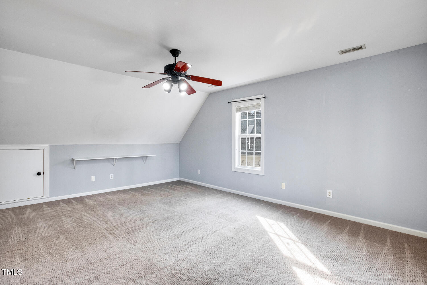 6324 Nowell Pointe Drive Raleigh, NC 27607 - Photo 39 of 50 a view of a room with window and ceiling fan