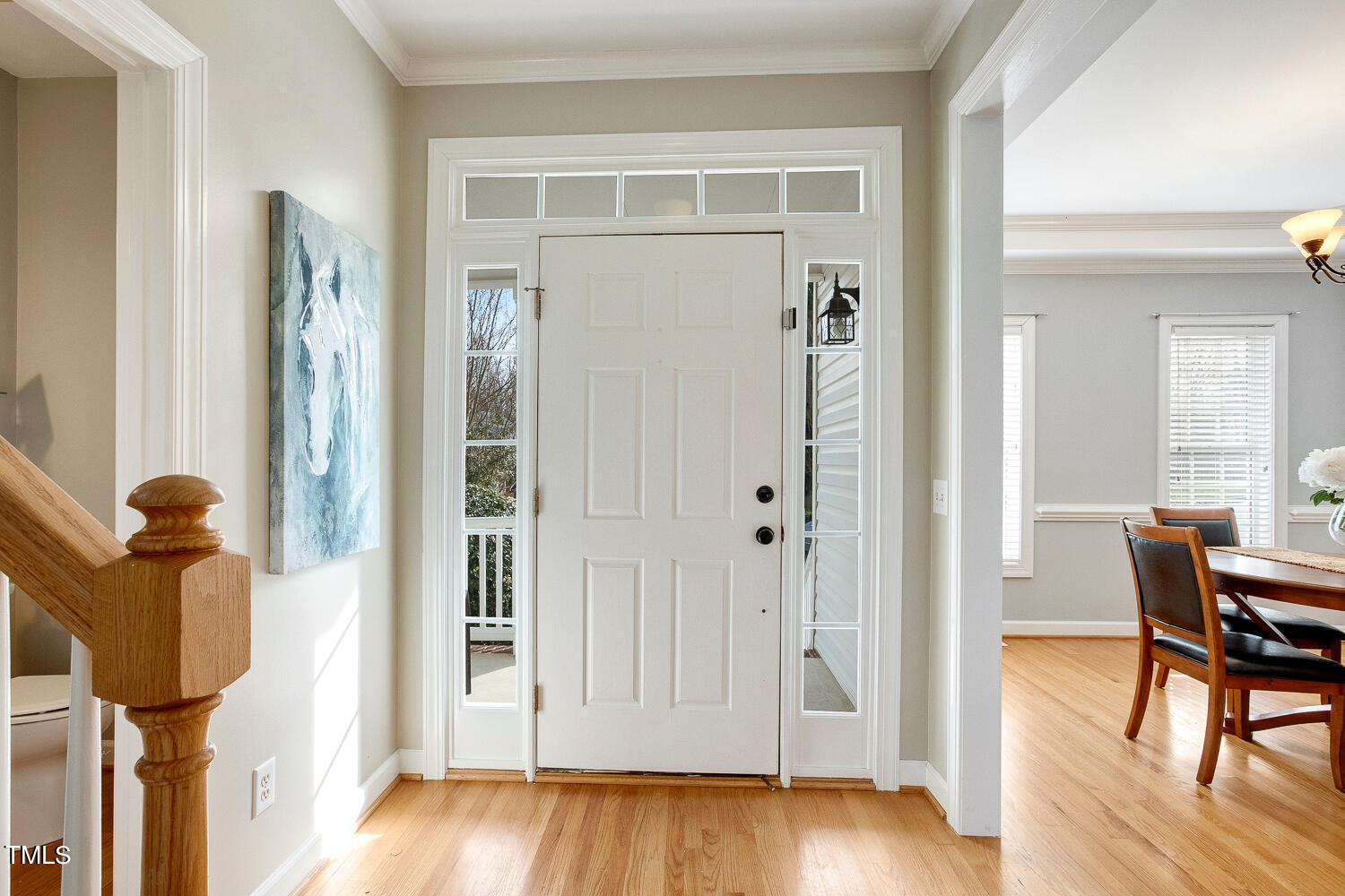 6324 Nowell Pointe Drive Raleigh, NC 27607 - Photo 4 of 50 a view of a hallway with wooden floor windows and livingroom view
