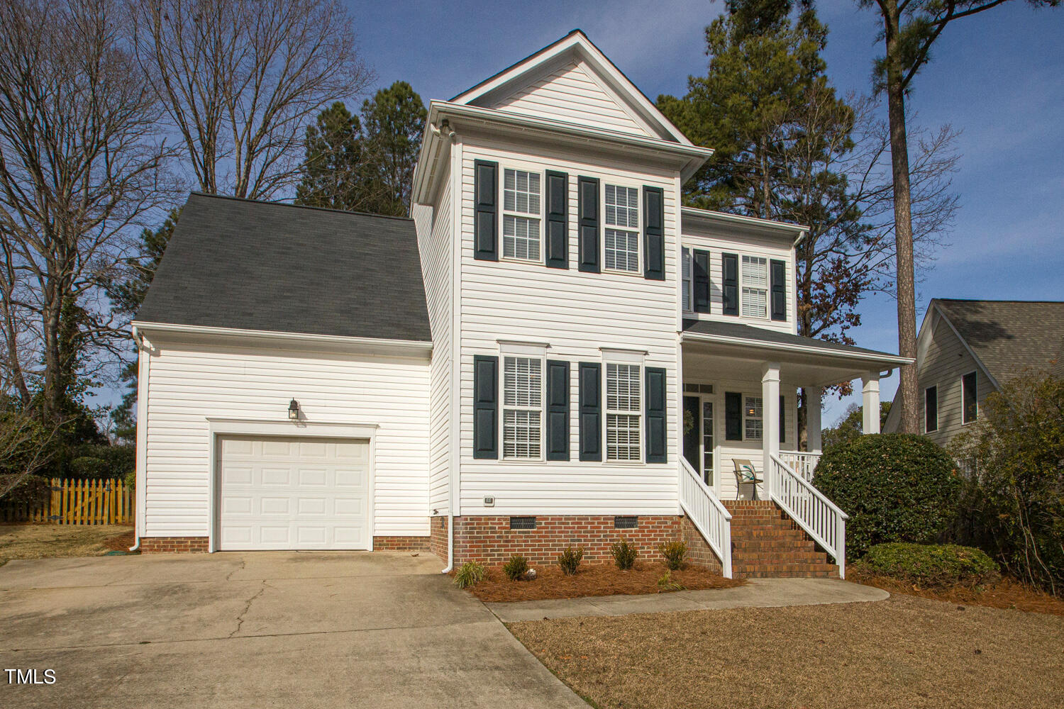 6324 Nowell Pointe Drive Raleigh, NC 27607 - Photo 50 of 50 a front view of a house with a yard and garage