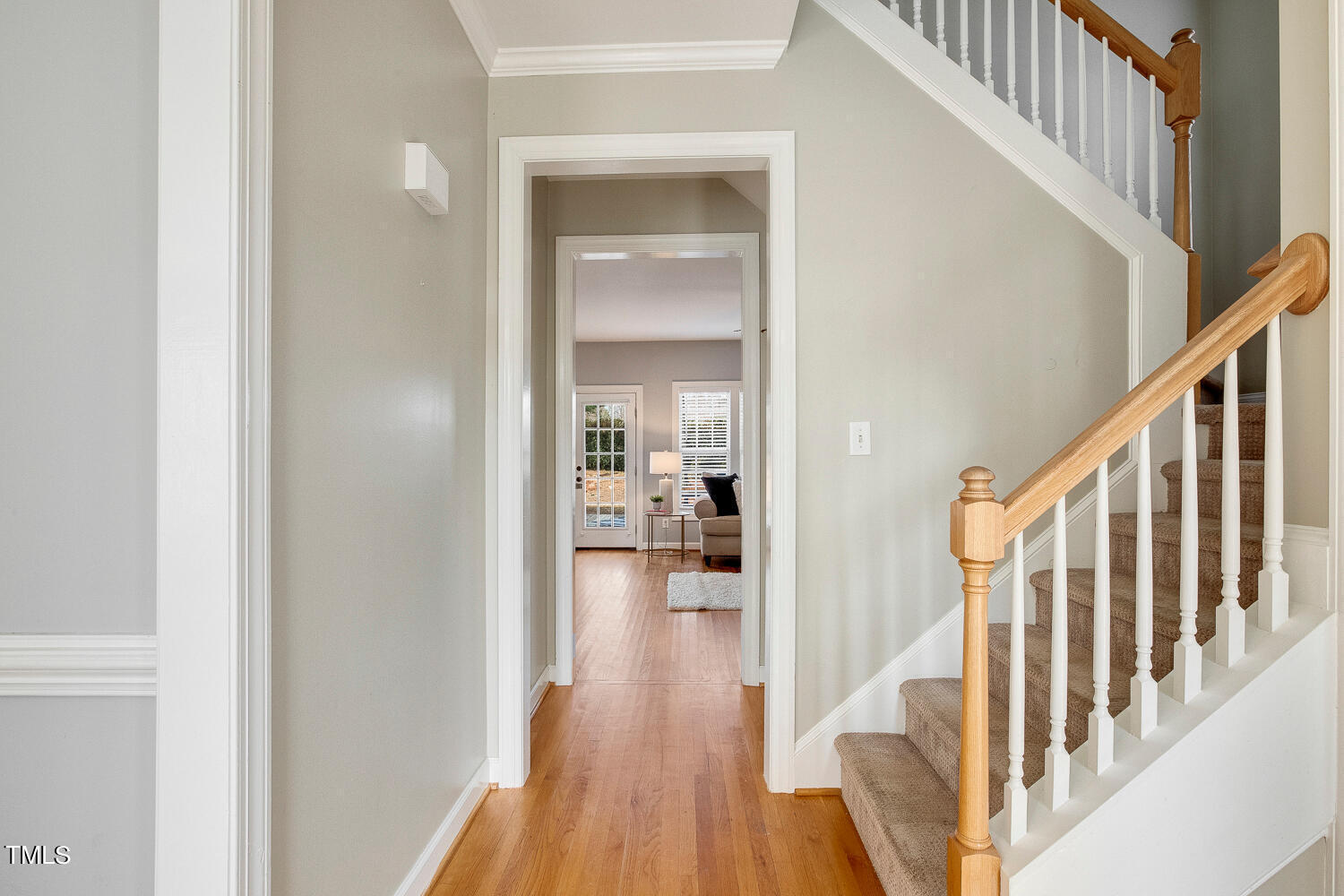 6324 Nowell Pointe Drive Raleigh, NC 27607 - Photo 5 of 50 a view of hallway with wooden floor and stairs