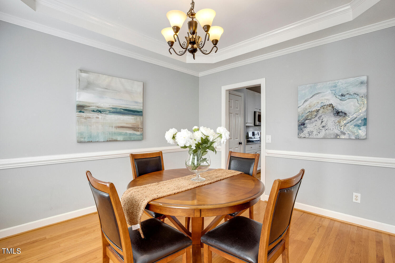 6324 Nowell Pointe Drive Raleigh, NC 27607 - Photo 8 of 50 a dining room with furniture and chandelier