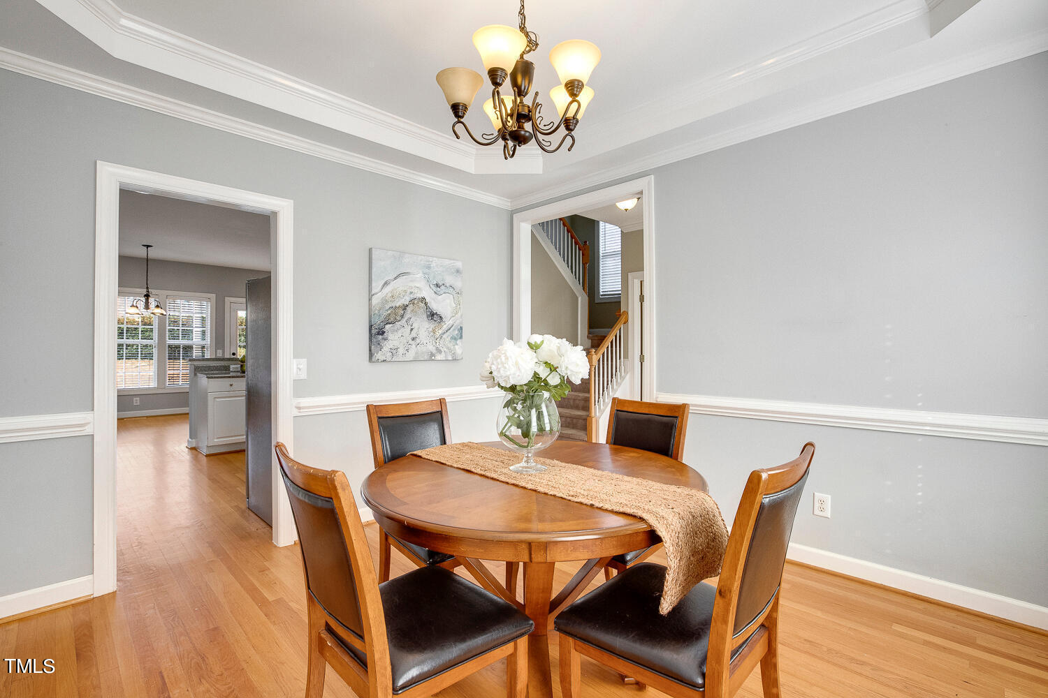 6324 Nowell Pointe Drive Raleigh, NC 27607 - Photo 9 of 50 a view of a dining room with furniture and wooden floor