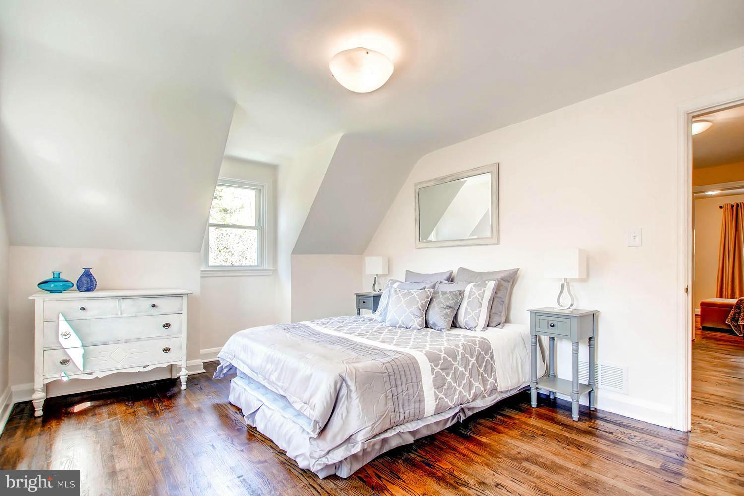 609 Cylburn Road Baltimore, MD 21208 - Photo 11 of 30 a bedroom with a bed and a window