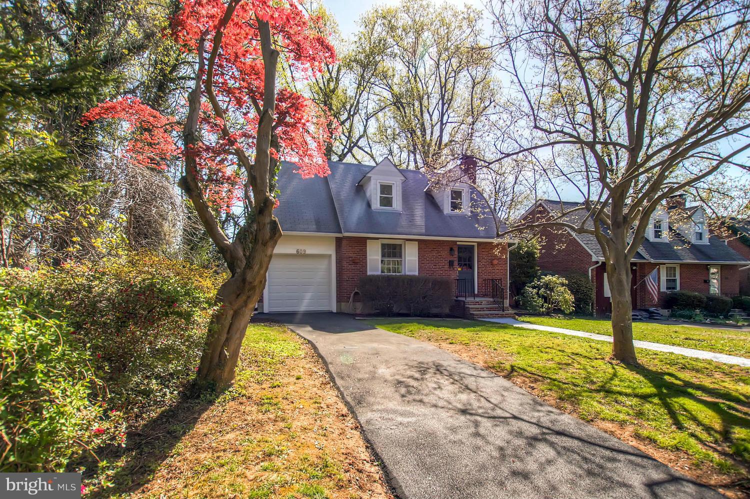 609 Cylburn Road Baltimore, MD 21208 - Photo 22 of 30 a view of a house with a yard and large trees