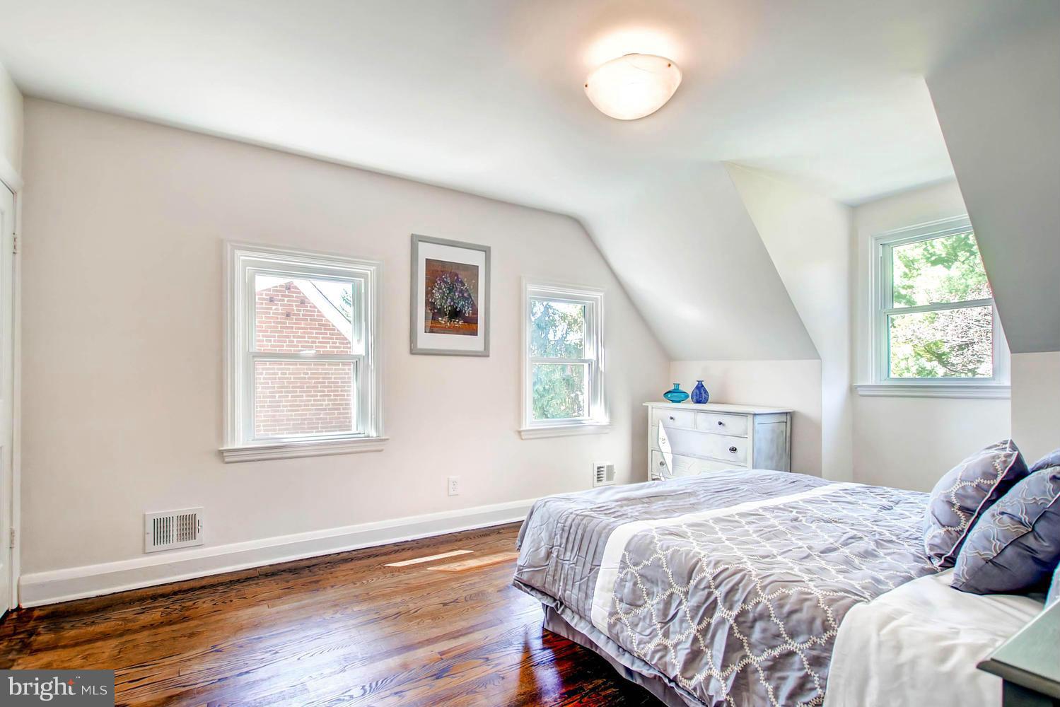 609 Cylburn Road Baltimore, MD 21208 - Photo 10 of 30 a bed sitting in a bedroom next to a window