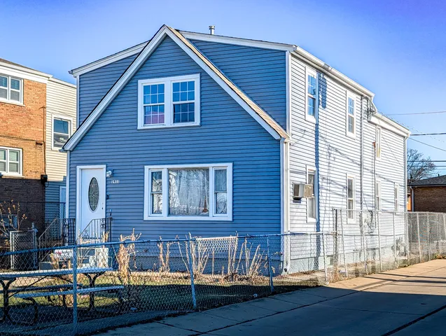 a front view of a house with yard