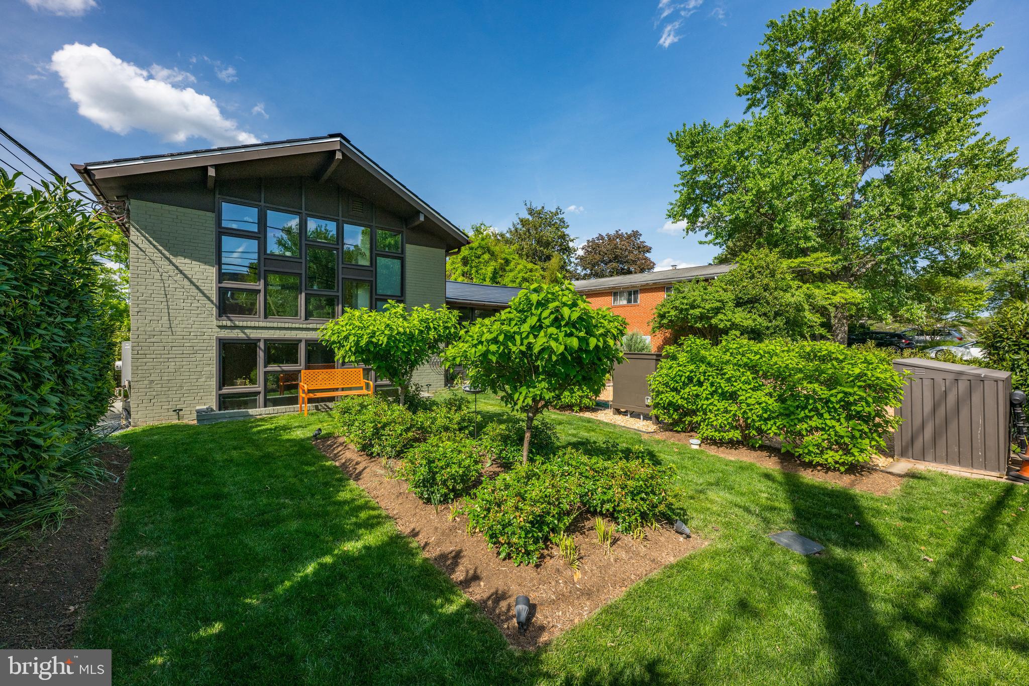 6109 Greentree Road Bethesda, MD 20817 - Photo 2 of 53 a front view of a house with garden