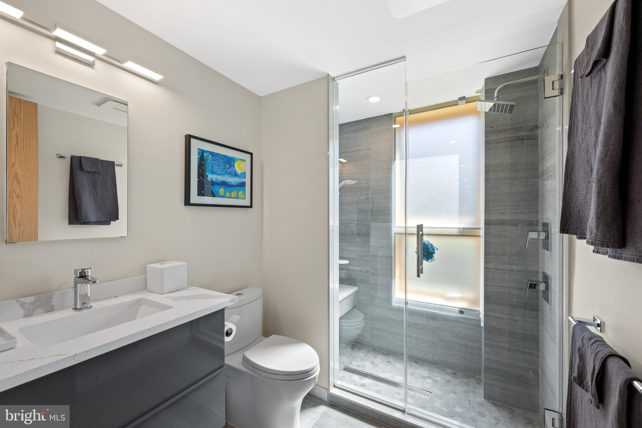 6109 Greentree Road Bethesda, MD 20817 - Photo 40 of 53 a bathroom with a sink toilet and shower