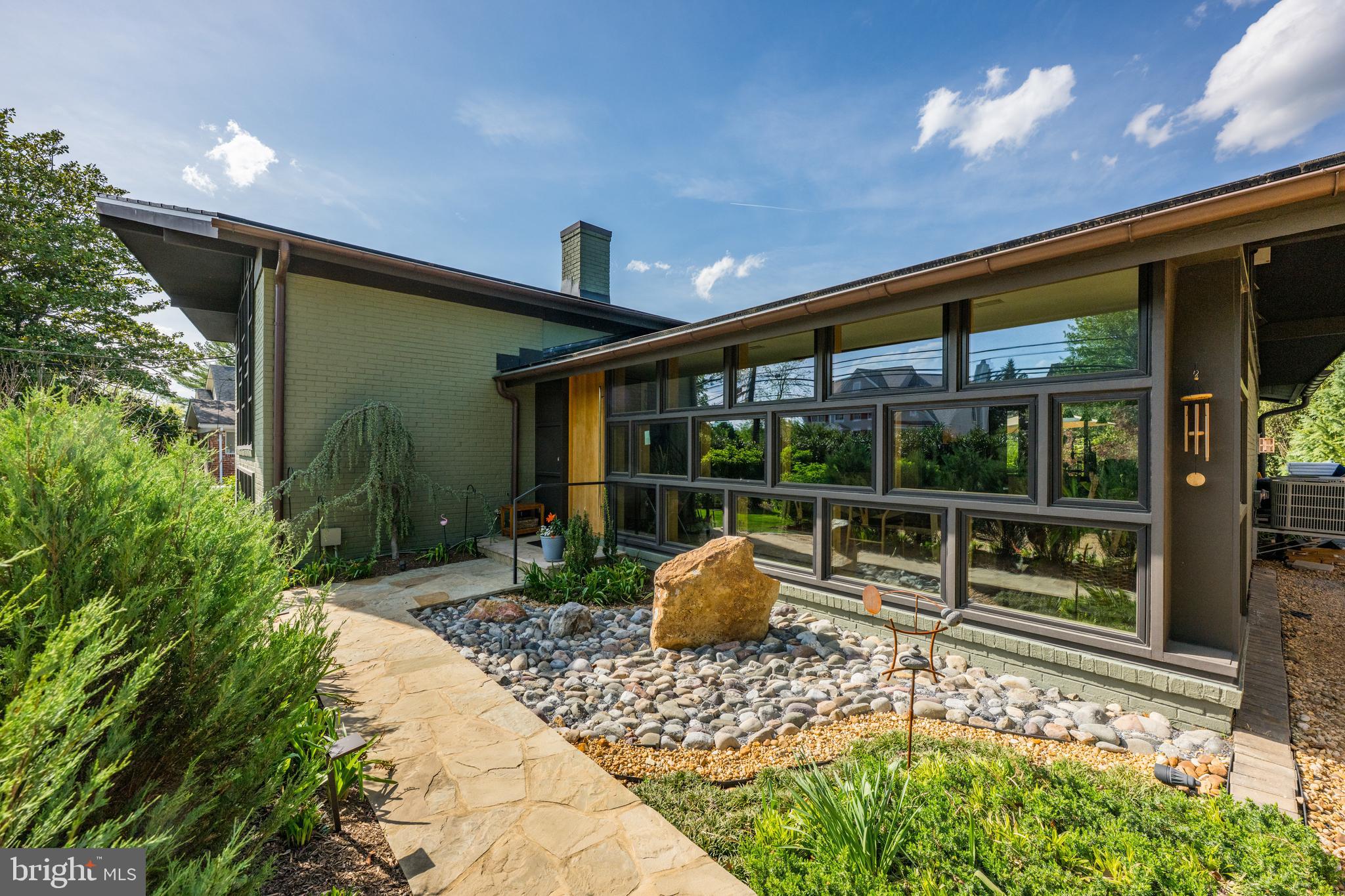 6109 Greentree Road Bethesda, MD 20817 - Photo 4 of 53 a front view of a house with garden