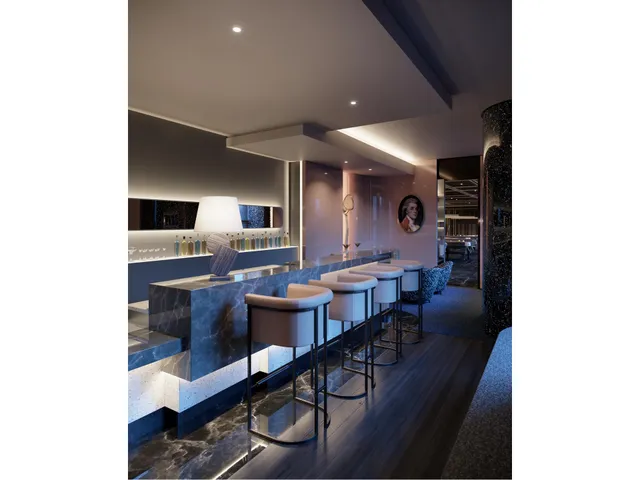 a living room with furniture and a mirror