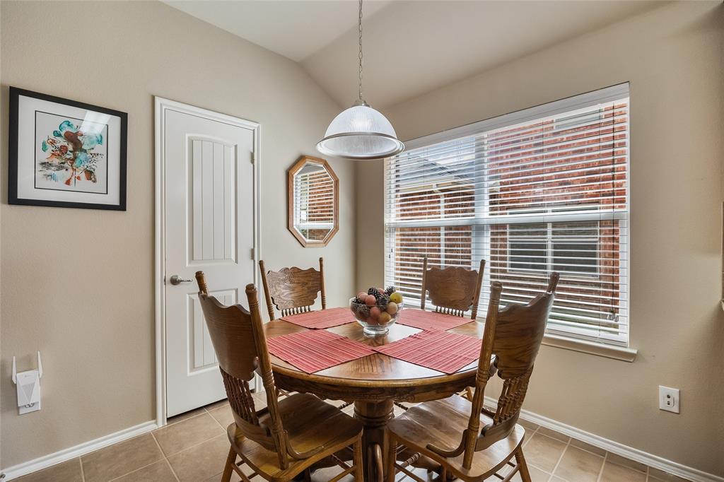 1260 Highbluff Lane Rockwall, TX 75087 - Photo 11 of 22 a view of a dining room with furniture window and wooden floor
