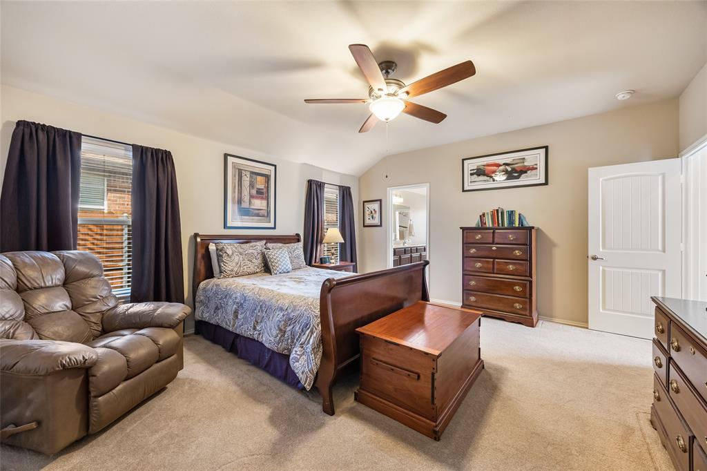 1260 Highbluff Lane Rockwall, TX 75087 - Photo 13 of 22 a spacious bedroom with a bed couch and a window