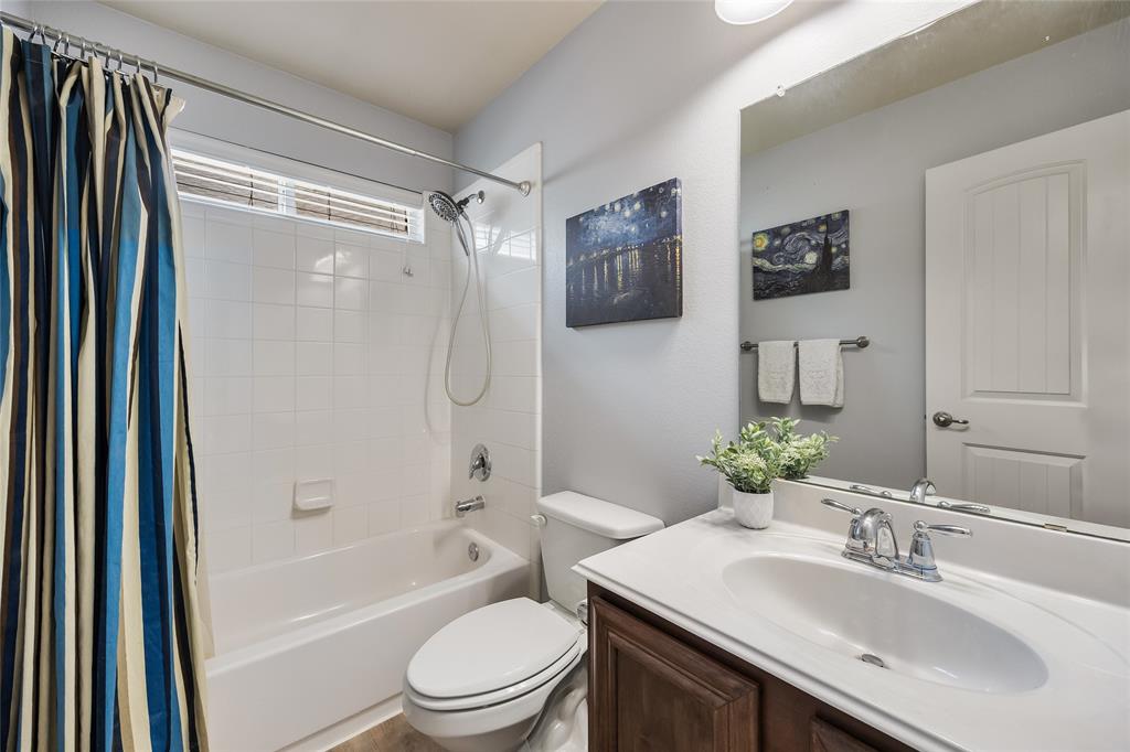 1260 Highbluff Lane Rockwall, TX 75087 - Photo 19 of 22 a bathroom with a sink toilet and shower