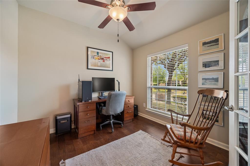 1260 Highbluff Lane Rockwall, TX 75087 - Photo 3 of 22 a view of a livingroom with lounge chair and a large window