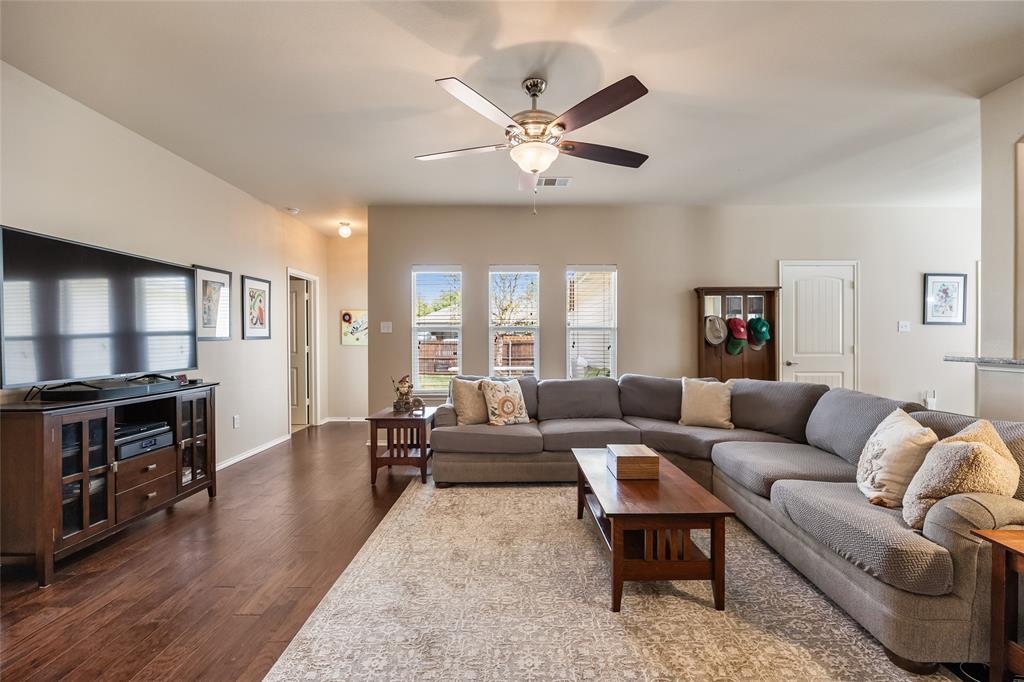 1260 Highbluff Lane Rockwall, TX 75087 - Photo 4 of 22 a living room with furniture and a fireplace