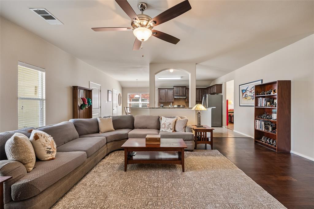 1260 Highbluff Lane Rockwall, TX 75087 - Photo 6 of 22 a living room with furniture and wooden floor