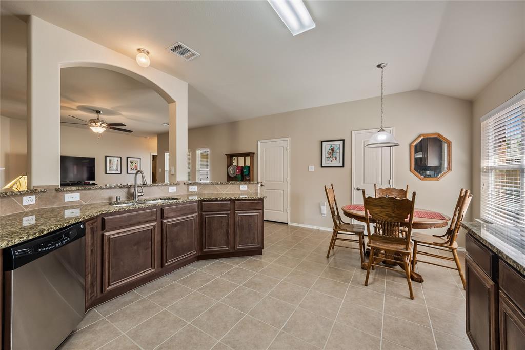1260 Highbluff Lane Rockwall, TX 75087 - Photo 9 of 22 a kitchen with cabinets and chairs