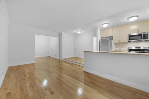 a view of kitchen and wooden floor