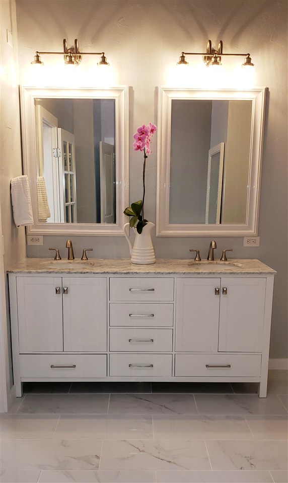 620 Awalau Road Haiku, HI 96708 - Photo 13 of 30 a bathroom with a sink vanity and mirror