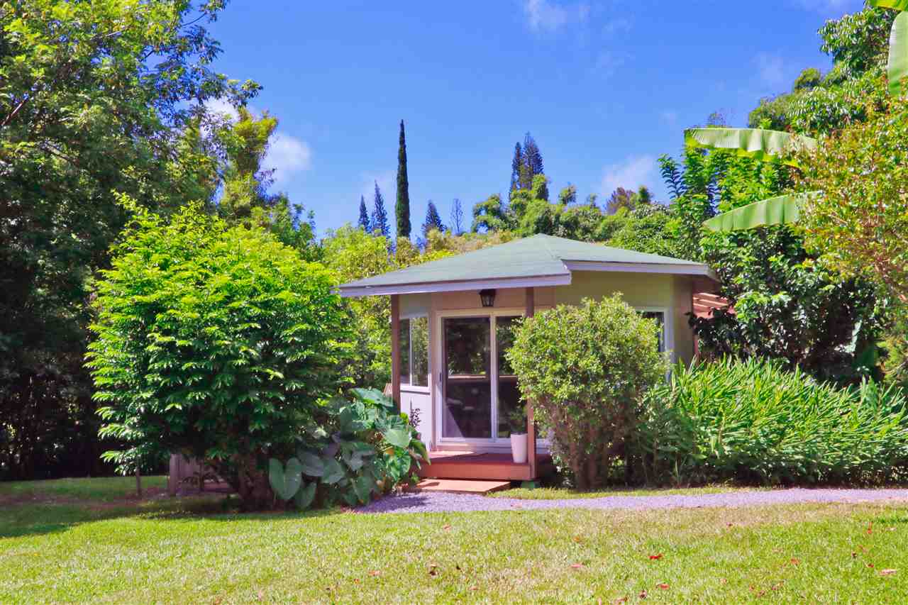 620 Awalau Road Haiku, HI 96708 - Photo 23 of 30 a front view of a house with a yard