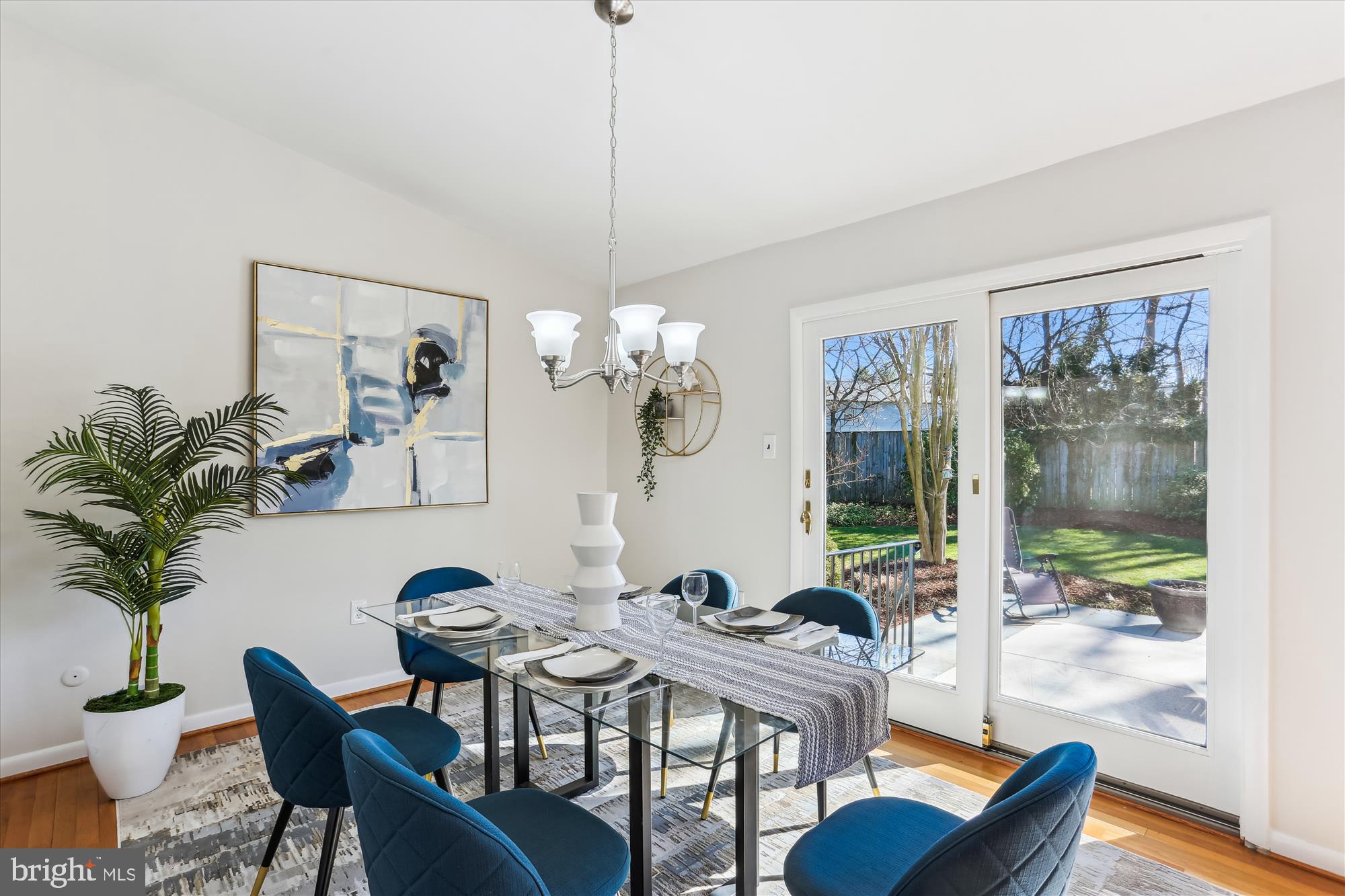 9 Fulham Court Silver Spring, MD 20902 - Photo 10 of 53 a view of a dining room with furniture a chandelier and wooden floor