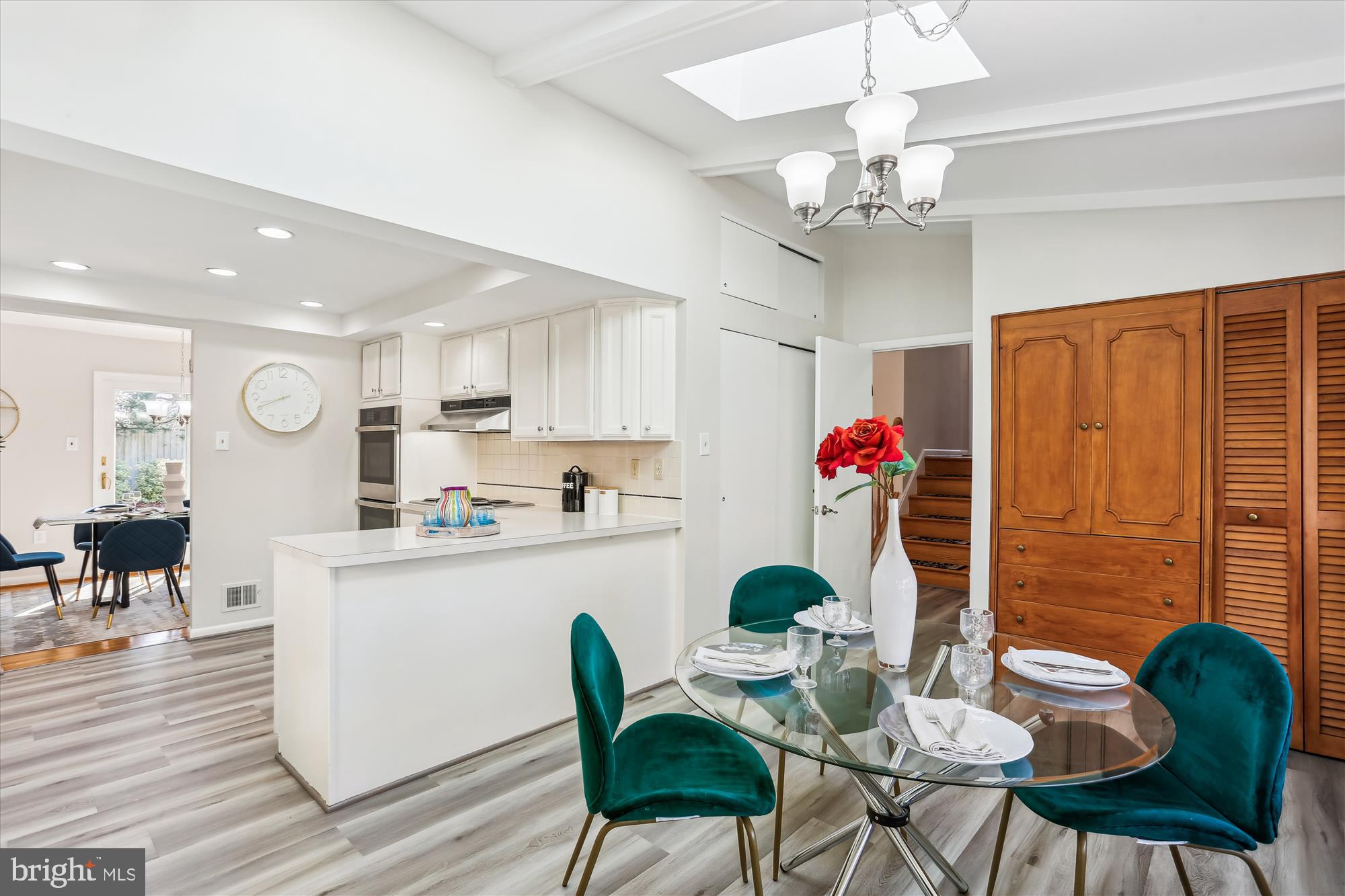 9 Fulham Court Silver Spring, MD 20902 - Photo 12 of 53 a dining room filled chandelier and kitchen view