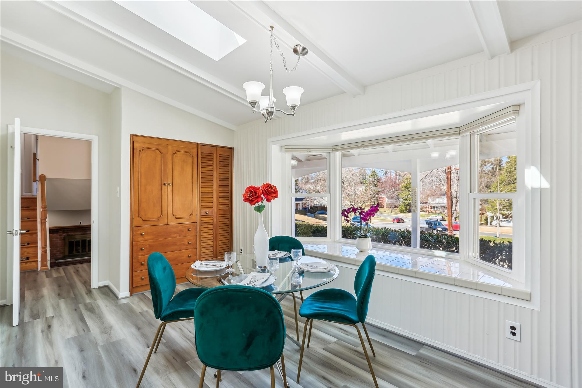 9 Fulham Court Silver Spring, MD 20902 - Photo 14 of 53 a view of a dining room with furniture a chandelier and wooden floor