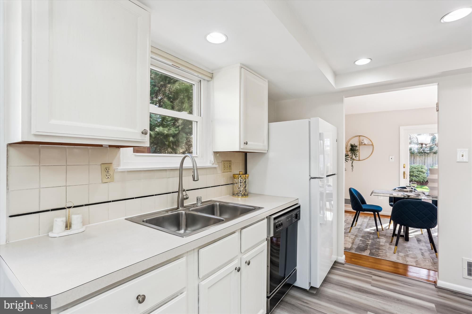 9 Fulham Court Silver Spring, MD 20902 - Photo 16 of 53 a kitchen with a sink cabinets and window