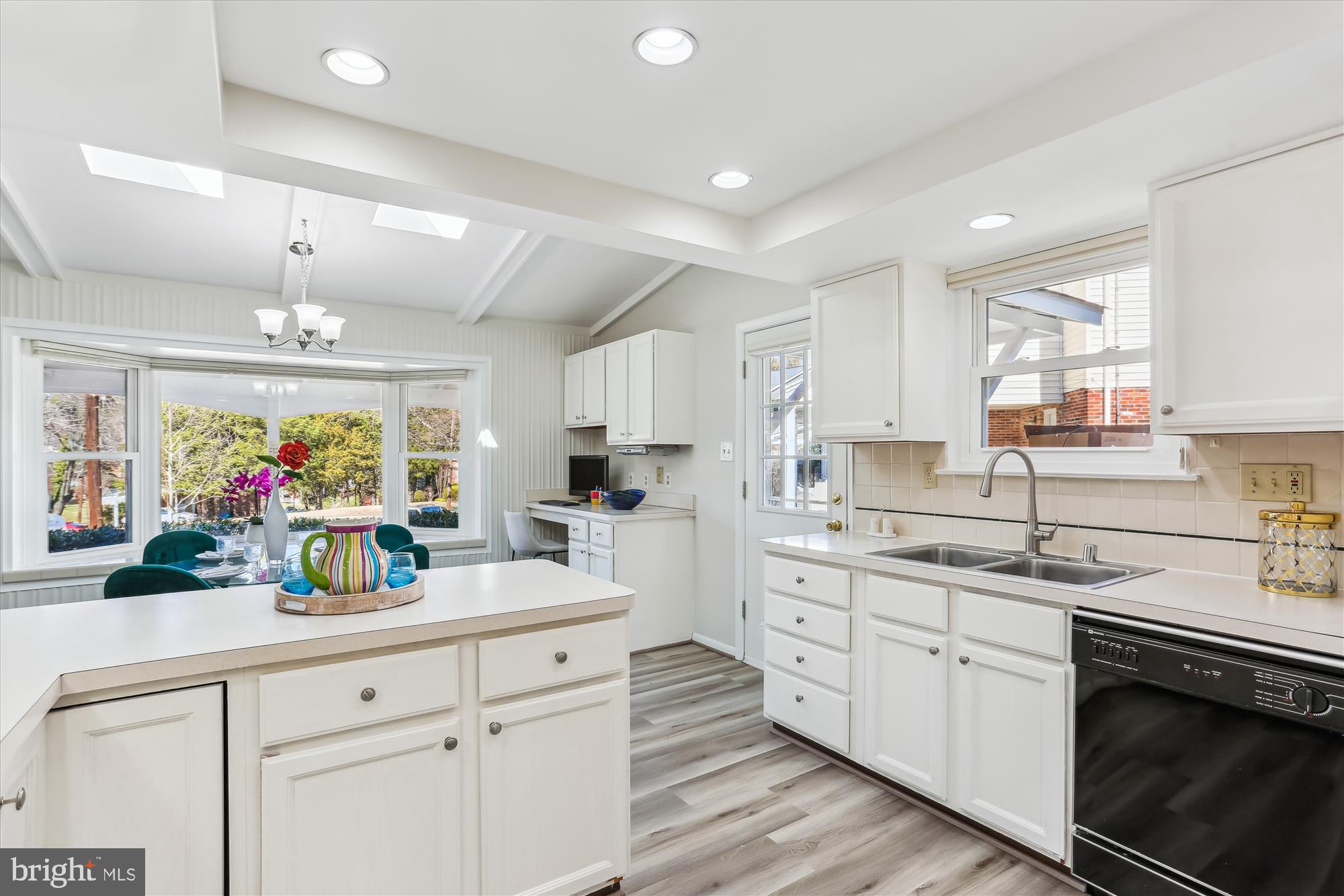 9 Fulham Court Silver Spring, MD 20902 - Photo 17 of 53 a kitchen with kitchen island white cabinets and refrigerator