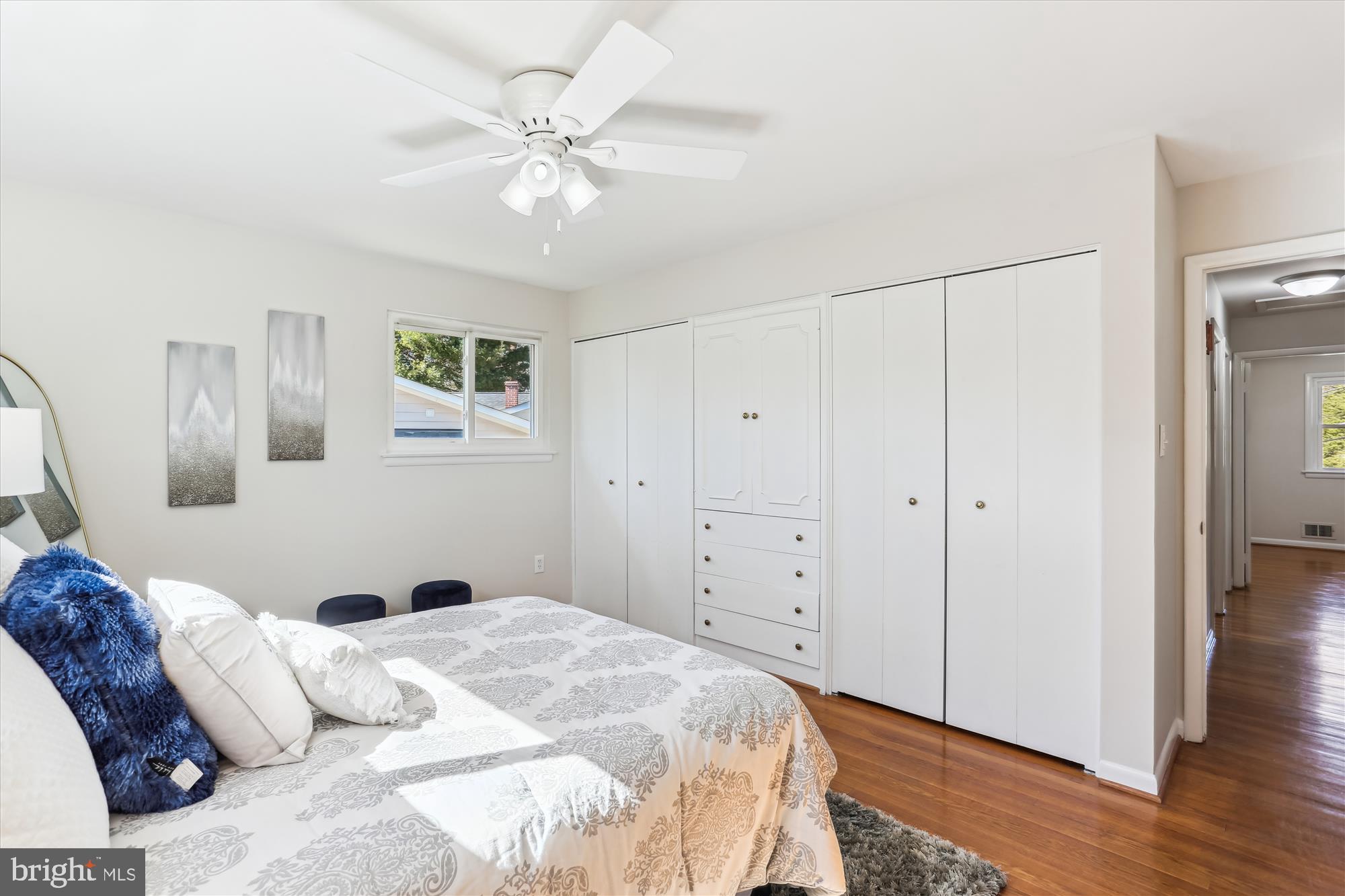 9 Fulham Court Silver Spring, MD 20902 - Photo 20 of 53 a bedroom with a large bed and wooden floor