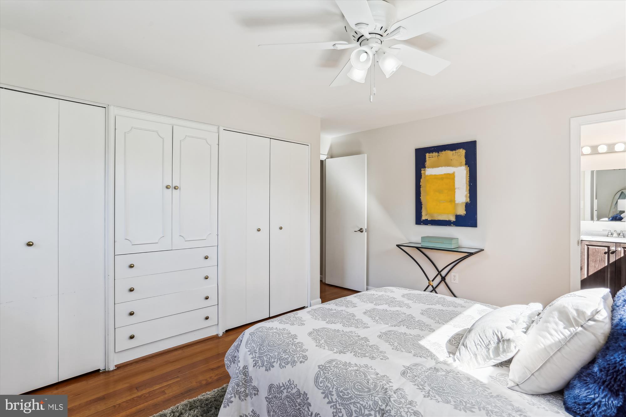 9 Fulham Court Silver Spring, MD 20902 - Photo 21 of 53 a bedroom with a bed and a chandelier