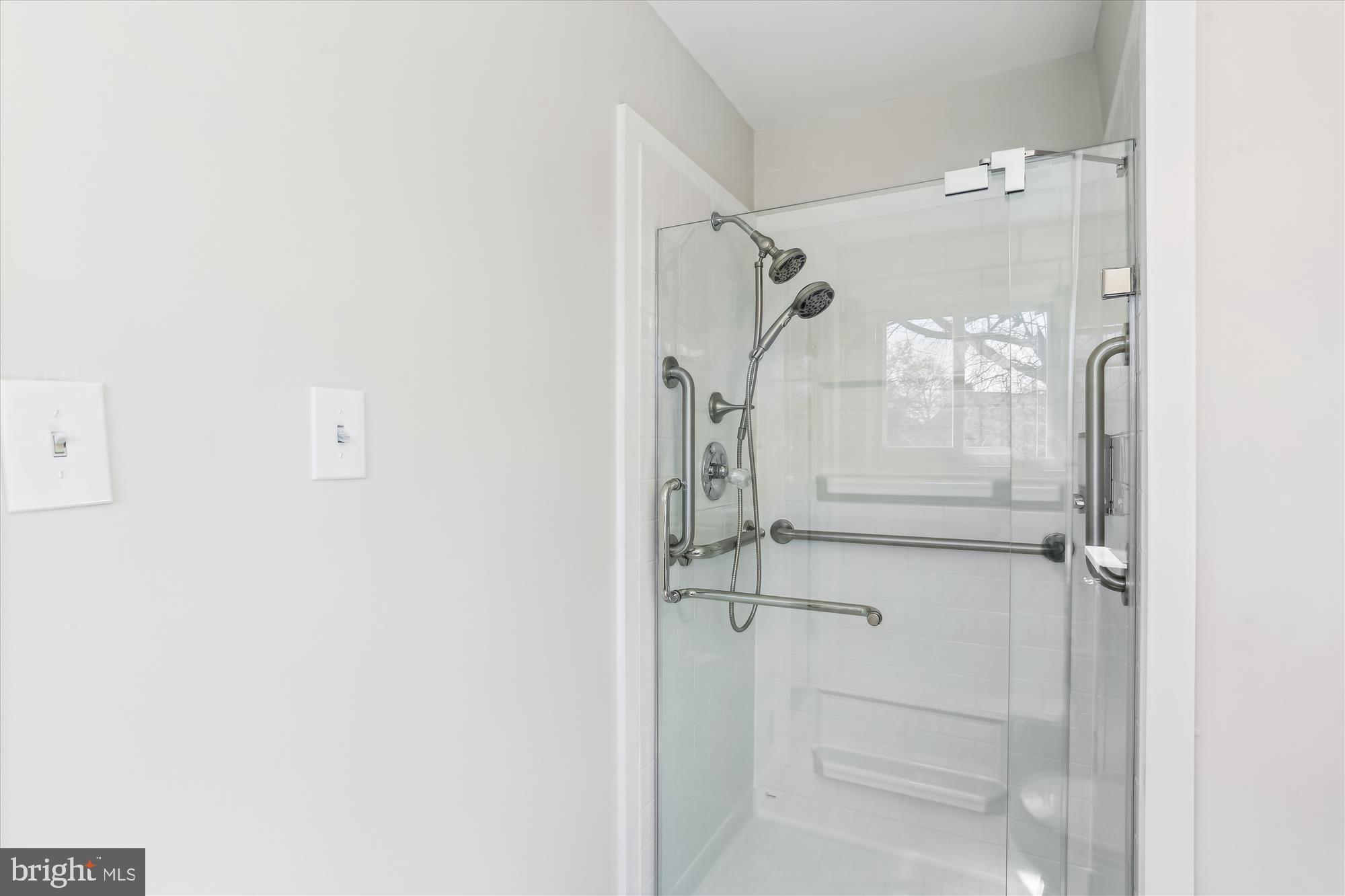 9 Fulham Court Silver Spring, MD 20902 - Photo 23 of 53 a bathroom with a glass shower door