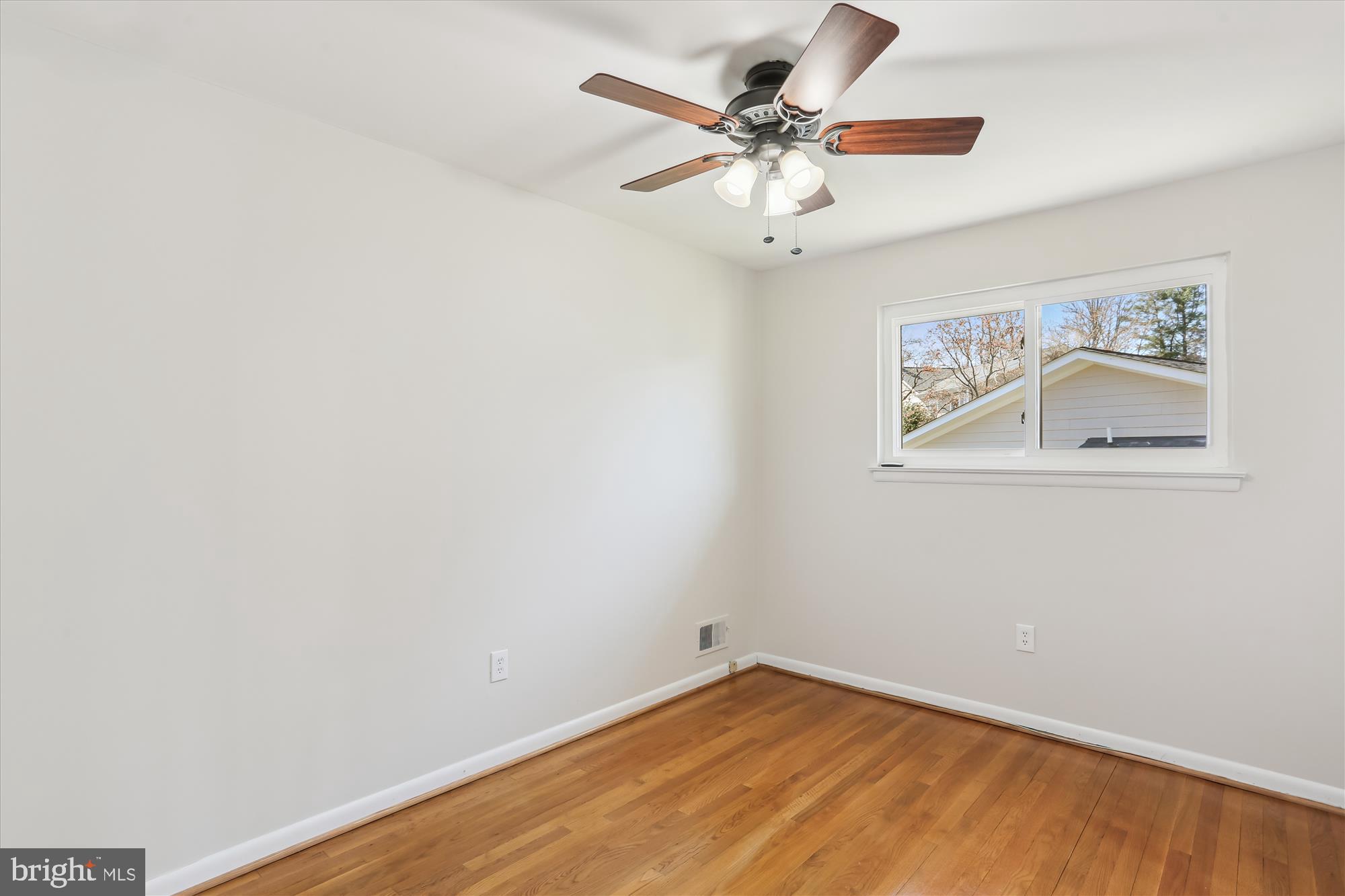 9 Fulham Court Silver Spring, MD 20902 - Photo 24 of 53 an empty room with a window