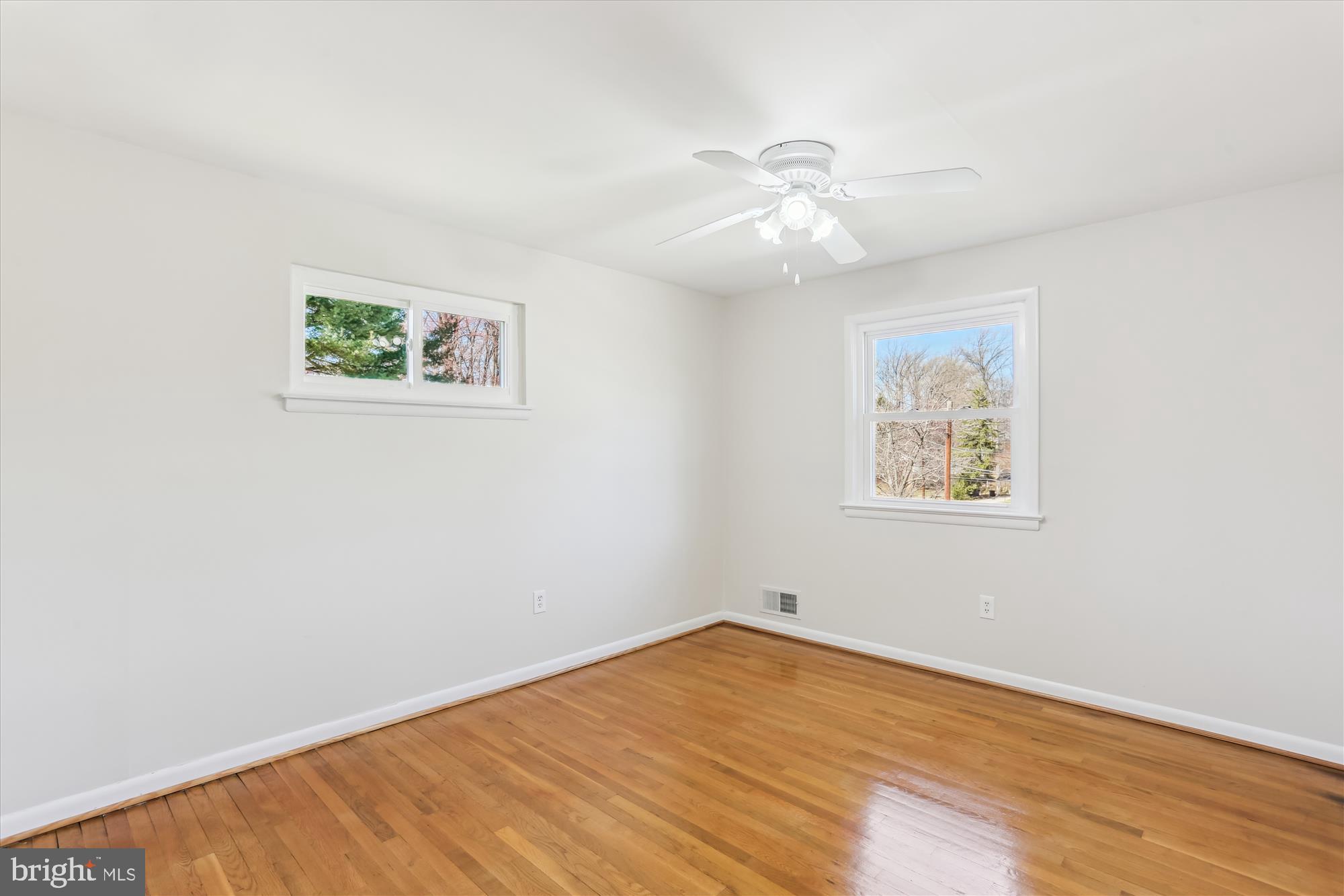 9 Fulham Court Silver Spring, MD 20902 - Photo 26 of 53 an empty room with a window and wooden floor