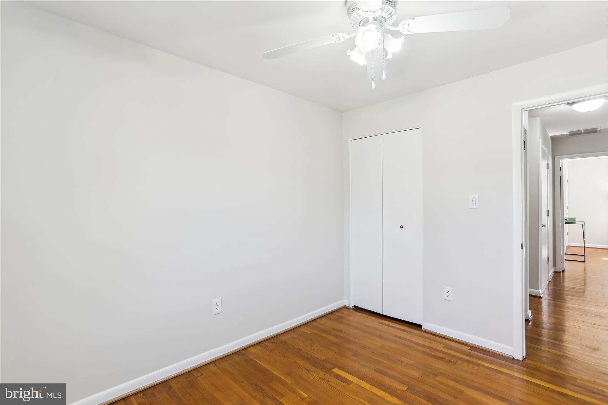 9 Fulham Court Silver Spring, MD 20902 - Photo 30 of 53 a view of an empty room with wooden floor
