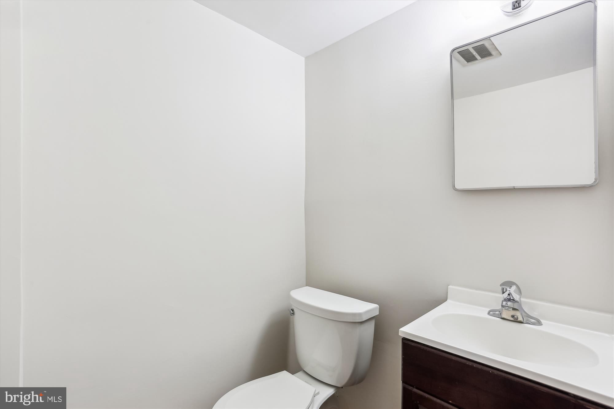 9 Fulham Court Silver Spring, MD 20902 - Photo 36 of 53 a white toilet sitting next to a bathroom sink