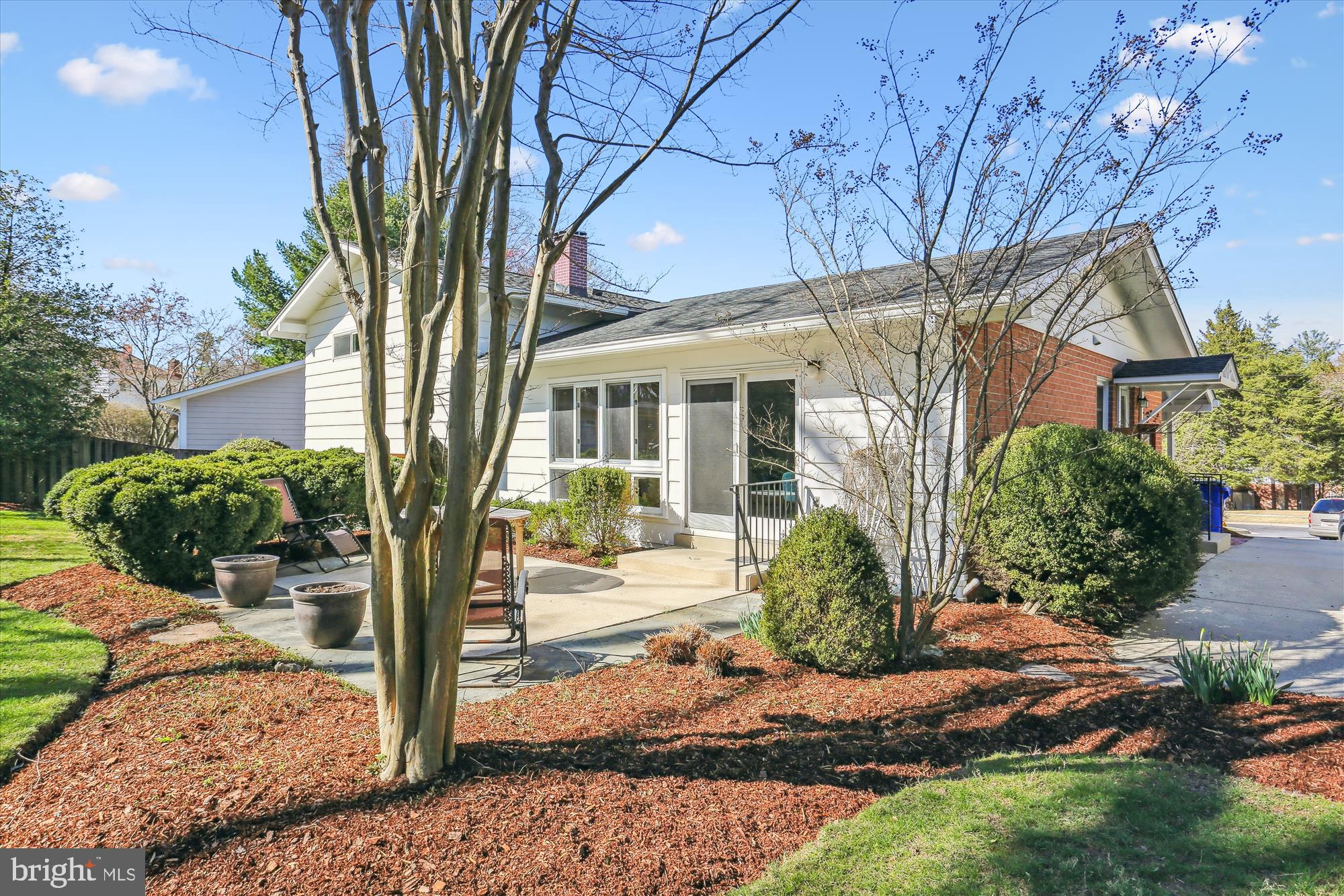 9 Fulham Court Silver Spring, MD 20902 - Photo 46 of 53 a front view of a house with a yard and potted plants