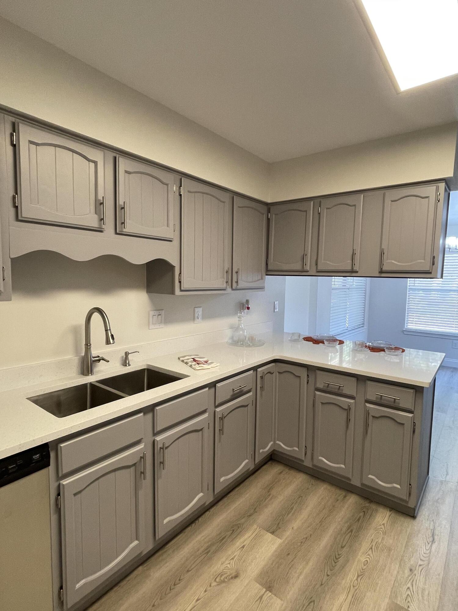 433 Barbados Way Niceville, FL 32578 - Photo 13 of 65 a kitchen with cabinets a sink and dishwasher