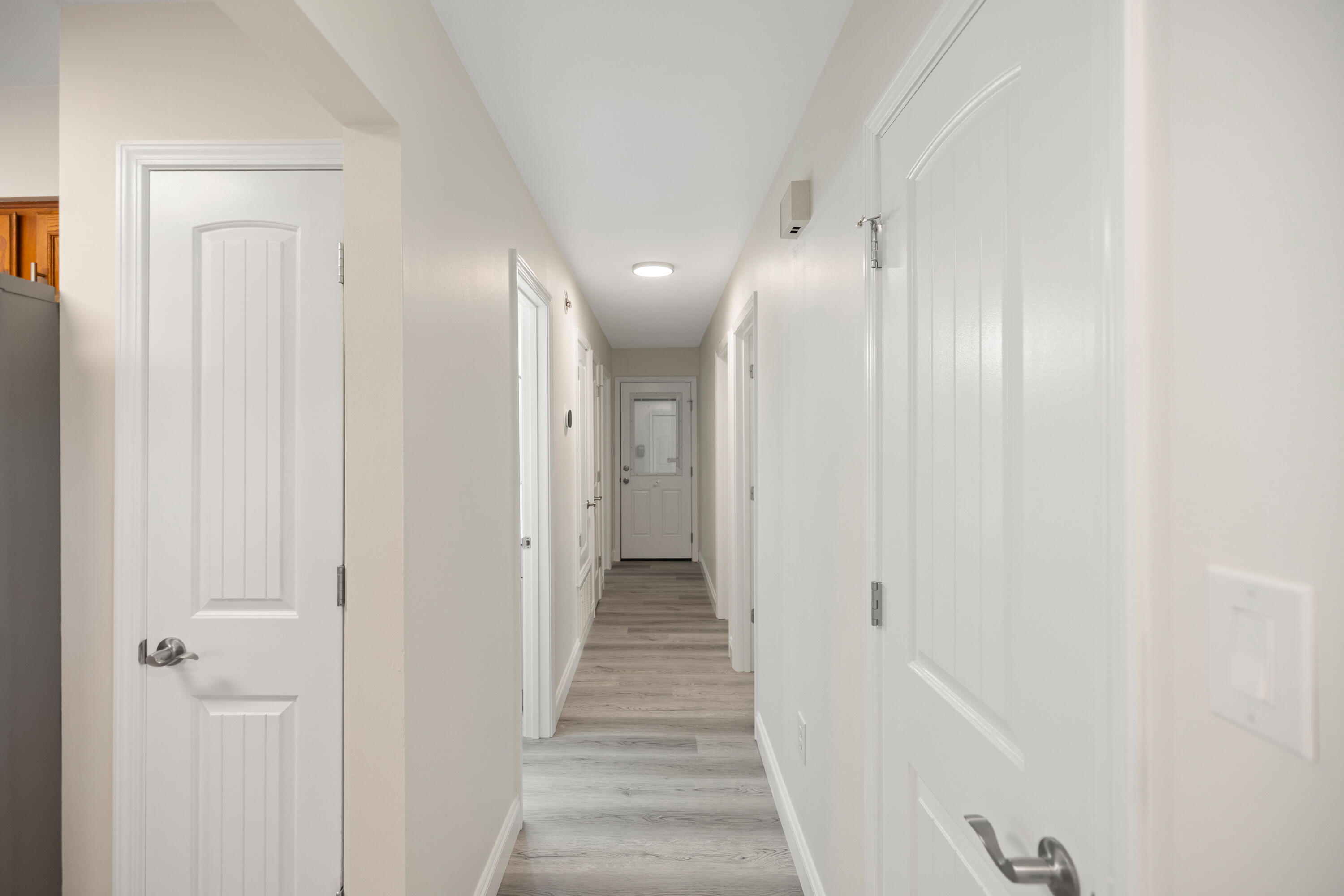 433 Barbados Way Niceville, FL 32578 - Photo 23 of 65 a view of a hallway with wooden floor and closet