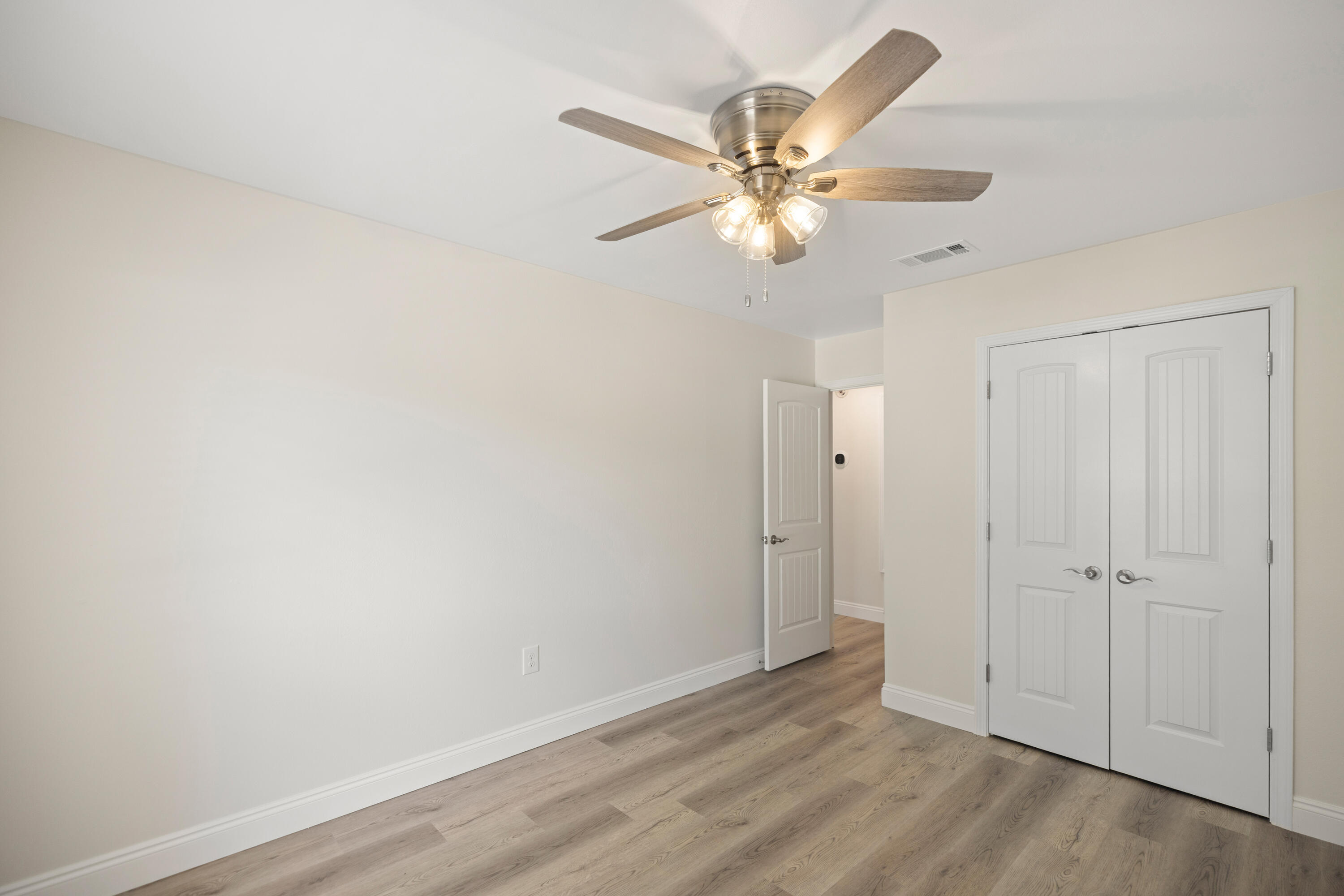 433 Barbados Way Niceville, FL 32578 - Photo 30 of 65 wooden floor in an empty room