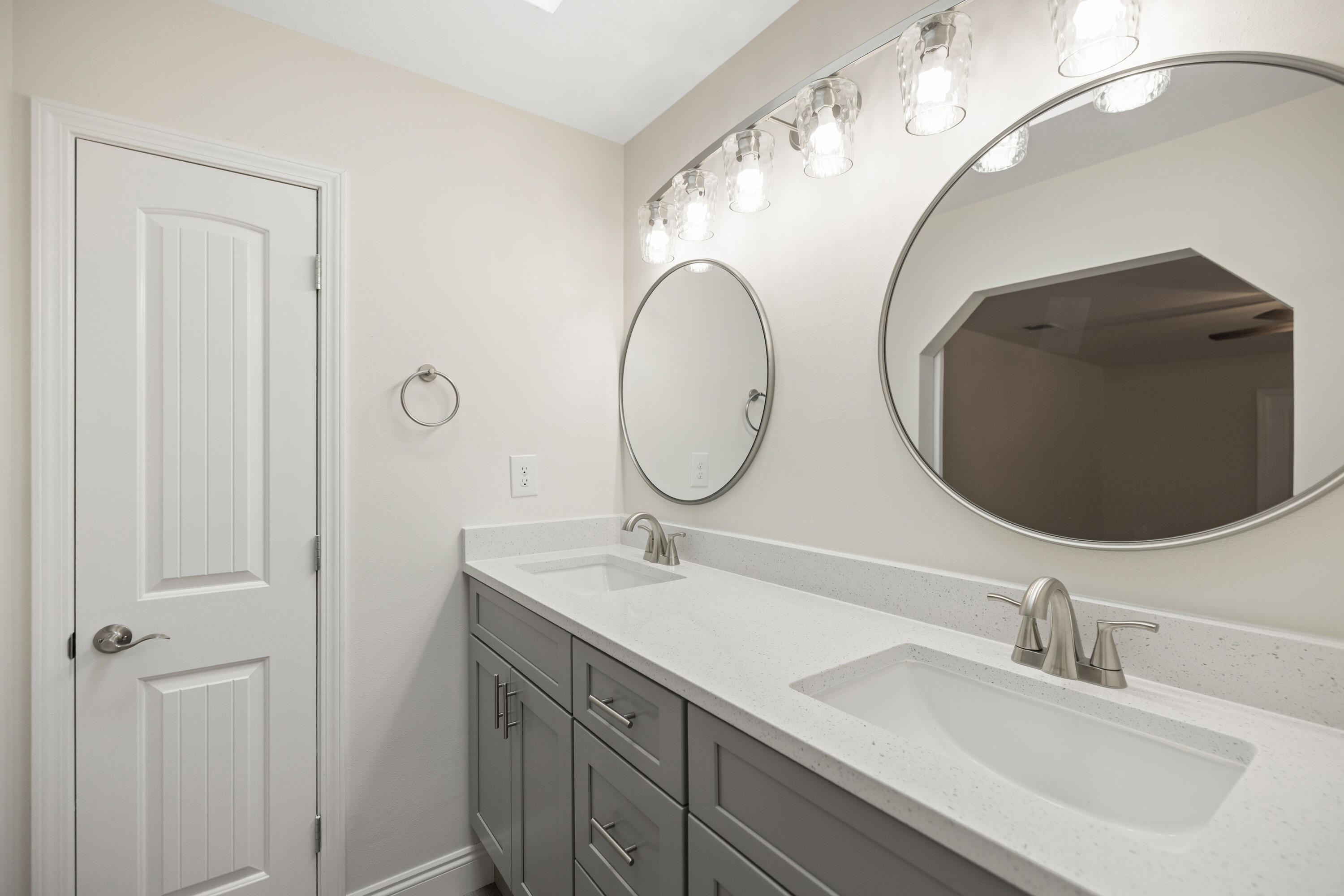 433 Barbados Way Niceville, FL 32578 - Photo 37 of 65 a bathroom with a double vanity sink and mirror