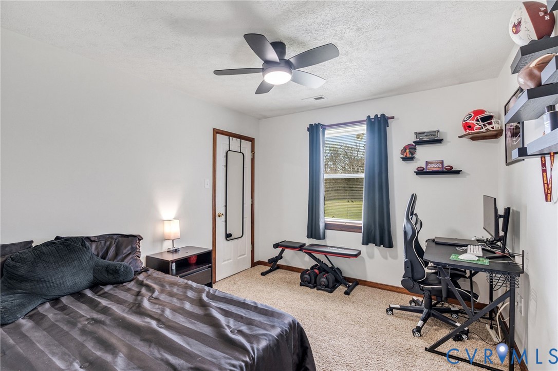 3411 Spring Run Road Mechanicsville, VA 23111 - Photo 15 of 41 a bedroom with a bed and a desk