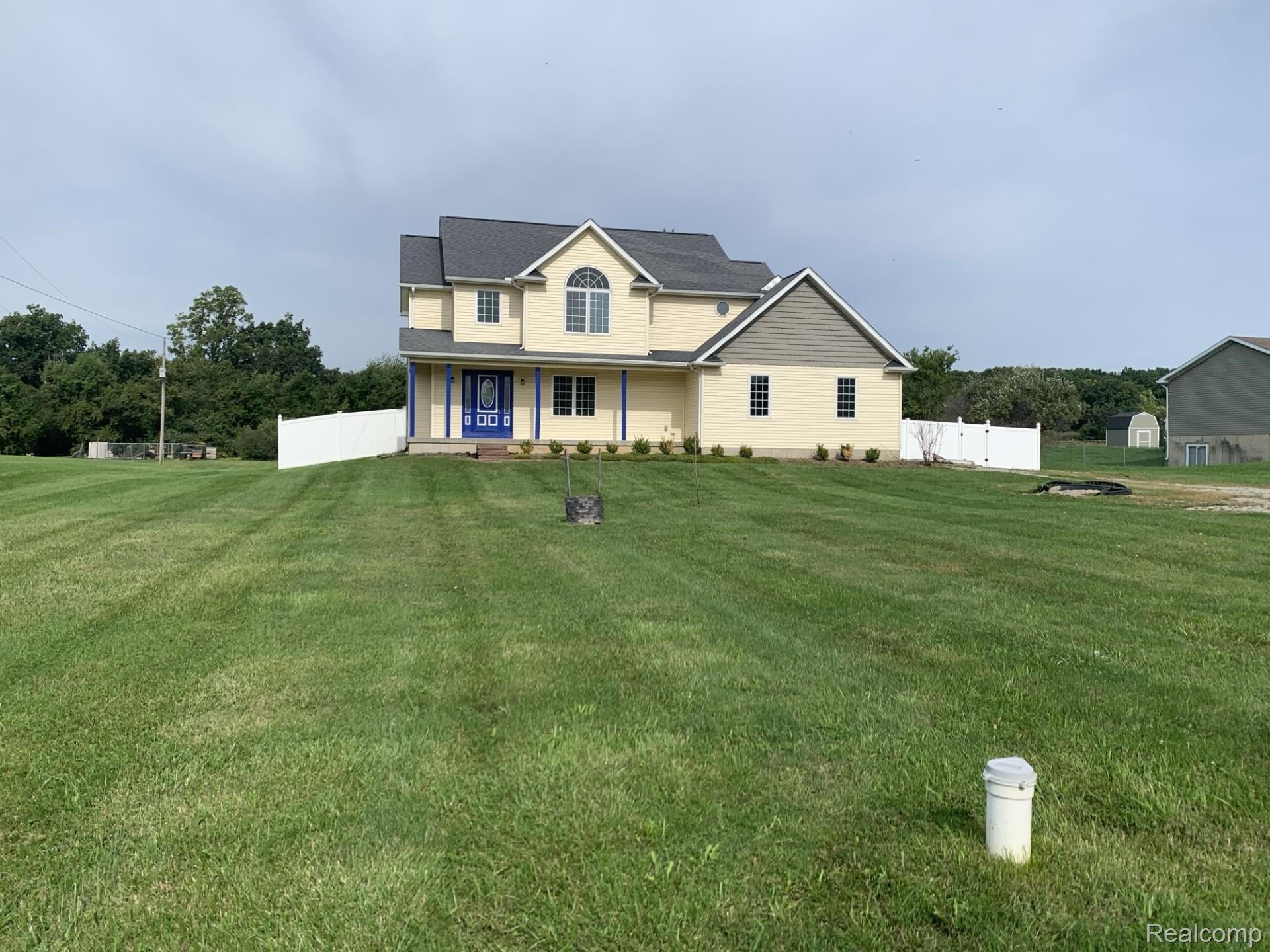 3068 West Cook Road Grand Blanc, MI 48439 - Photo 2 of 31 Two-story residence with a light yellow exterior