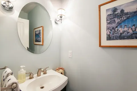 a bathroom with a sink and mirror