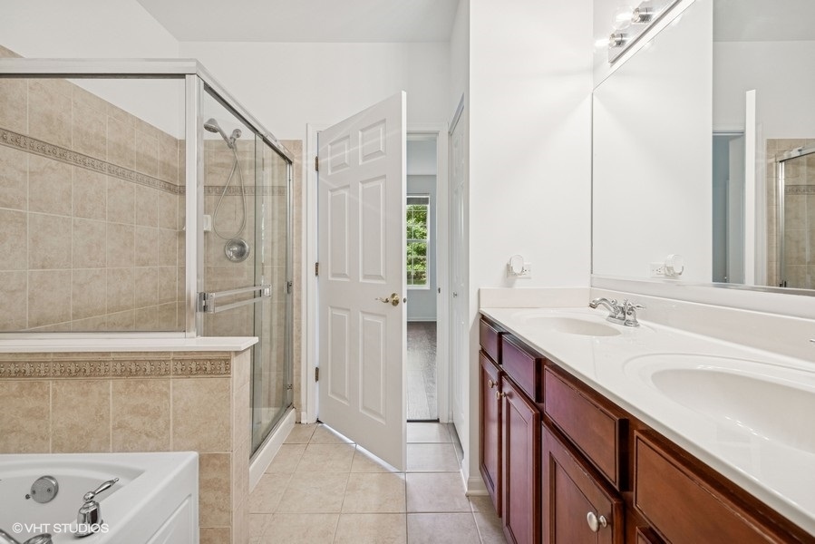 1541 Millbrook Drive, Unit 1541 Algonquin, IL 60102 - Photo 13 of 17 a bathroom with a sink and a mirror