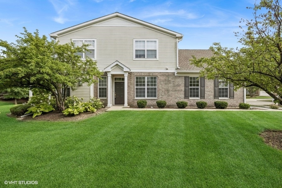 1541 Millbrook Drive, Unit 1541 Algonquin, IL 60102 - Photo 2 of 17 a view of a house with backyard