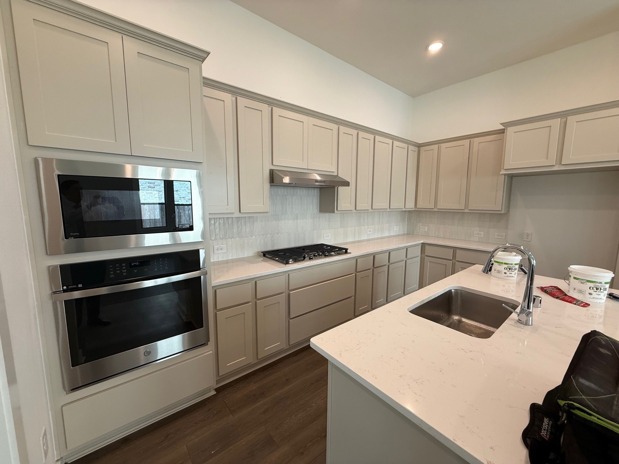 16383 Placid Strm Street Conroe, TX 77302 - Photo 2 of 15 a kitchen with a sink and stainless steel appliances